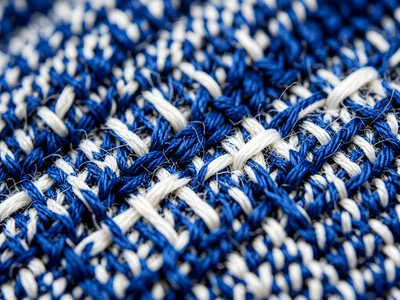Raw denim weave macro, indigo warp crossing white weft, diagonal twill pattern v