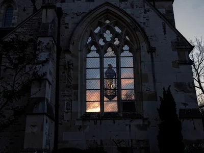 Church window from outside at dusk