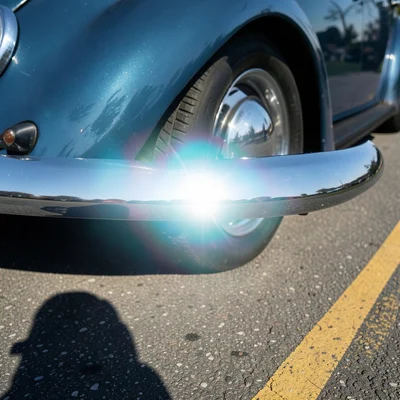 > A chrome bumper of a 1968 Beetle photographed at close range, the bumper filling the central horizontal band of a squa