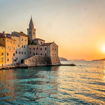 Adriatic limestone warmth, Dubrovnik honey stone, Bell tower silhouette against 