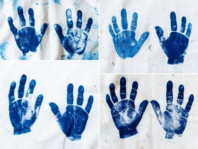 A collection of finger and thumb prints on cyanotype paper — varied pressure, va
