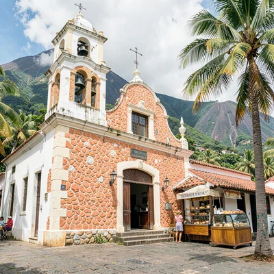 French Caribbean fusion in Guadeloupe, Colonial church facade, coral stone white
