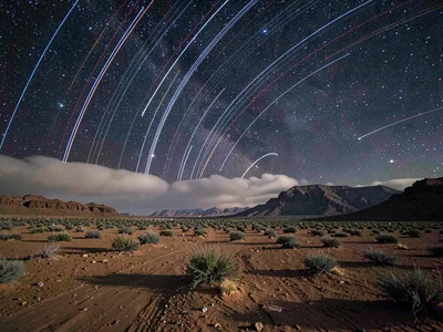 Trails through thin cloud creating glow