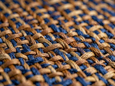 Tabby weave of ramie threads dyed walnut-brown shows even checkerboard rhythm wi