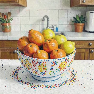 Bowl of oranges and lemons on a kitchen table, each fruit a different dot color 