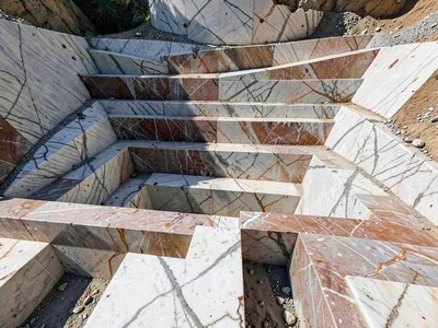 Extraction block shadows creating strong geometric rhythm