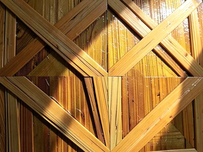 A finished straw panel under raking light — the reflective inner straw surface g