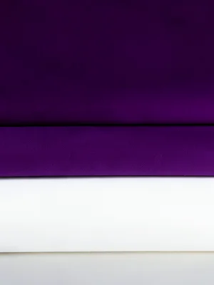 Tulle layers in gradient from deep purple to white, fashion editorial lighting