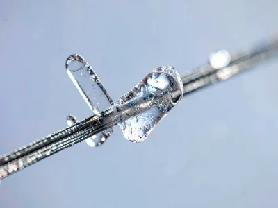 Sugar crystal growing on string closeup