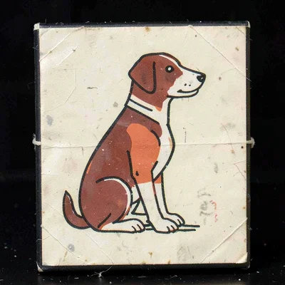 Czech matchbox label illustration, a dog in sitting profile pose , vintage Easte