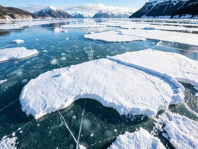 Surface texture where snow melted on clear ice
