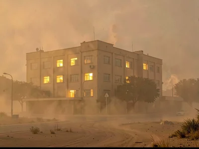 Building with lights on rendered spectral by dust