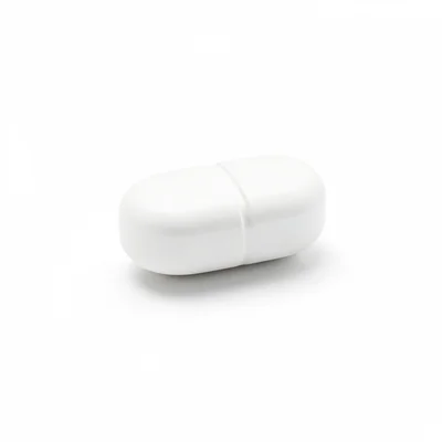 Single white pill on white background, pharmaceutical perfection, shadow suggest