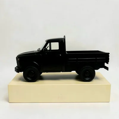 Centered hero of a small flatbed truck silhouette on a butter-yellow block, hair