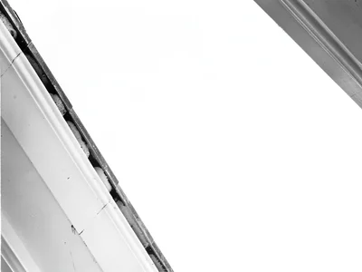 Cornice edge against white sky