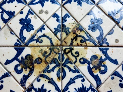 Water stain on tilework creating natural overlay