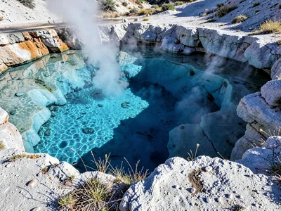 Clear hot spring showing blue depth
