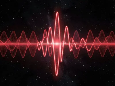 Heartbeat shown as rhythmic red pulse waves through dark space