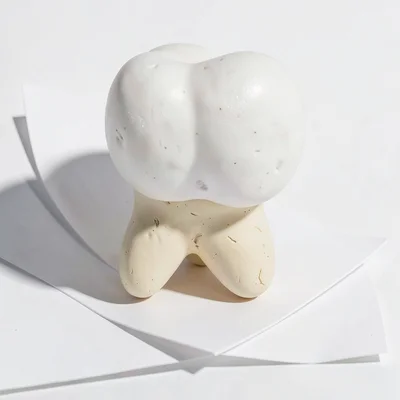 Pillowy chunky clay tooth in primary white with stubby cream-toned root and over