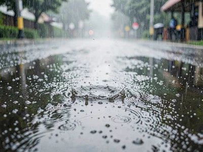 Rain creating texture in puddle