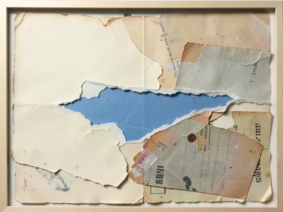 Single large tear in cream paper revealing blue paper beneath, the torn edge a d