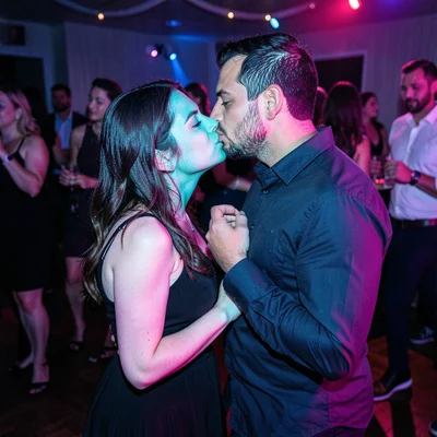 Two strangers almost kissing on a dance floor, her face cyan his face magenta, t