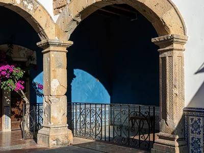 Wrought-Iron Balcony Railing on Indigo Wall