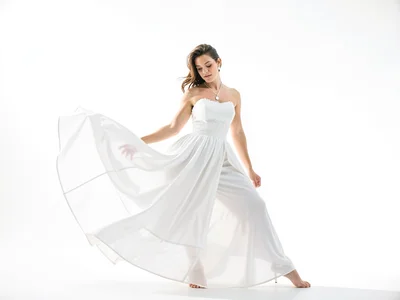 White dress flowing in light