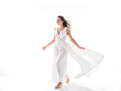 White dress flowing in light