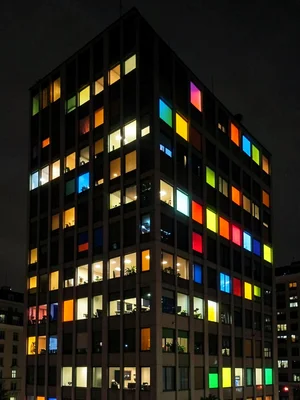 Office building at night, random lit windows making unintentional Mondrian