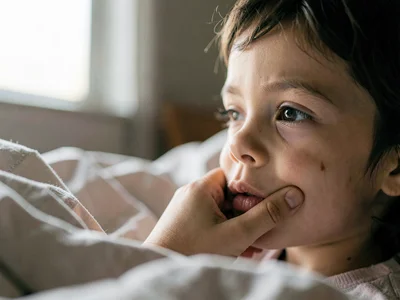 Parent waking to child's face inches away, the startling first sight of the day,