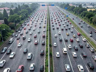 Highway overhead with vehicles dense as particles
