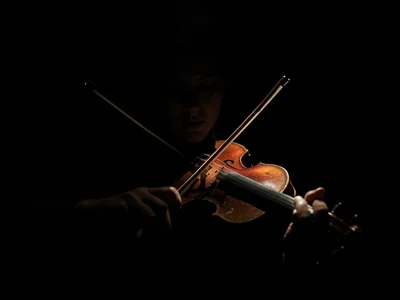 Violin and bow in pool of light