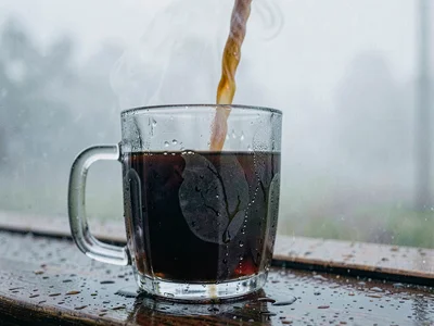 Hot drink steaming in cool humid morning, moisture meeting moisture