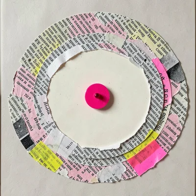 Concentric rings of torn newsprint surround a fluorescent pink dot pinned dead c