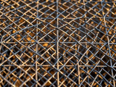 Wire sculpture cornucopia, woven fine gauge, autumn light casting shadow