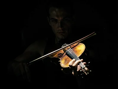 Violin and bow in pool of light