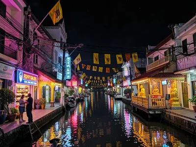 Buddhist flags near neon and wires