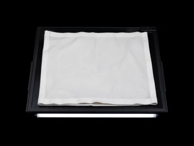 Fabric laid directly on scanner, threads in perfect focus at glass contact point