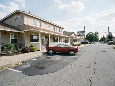 Roadside motel with vintage car parked