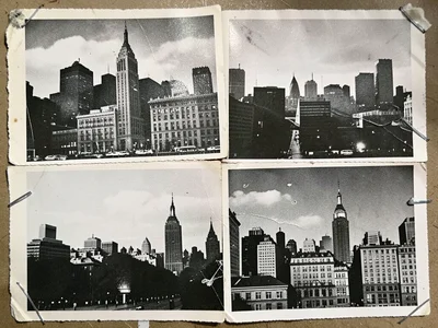 Layered silhouettes of city skylines from different postcards, each at a slightl