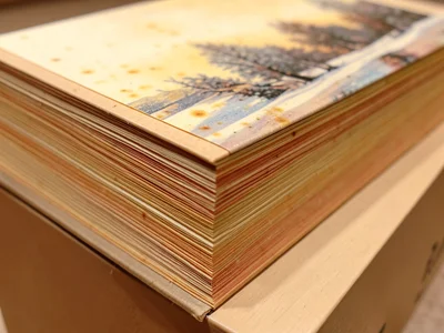 Fore-edge painting on book showing winter scene when pages fanned