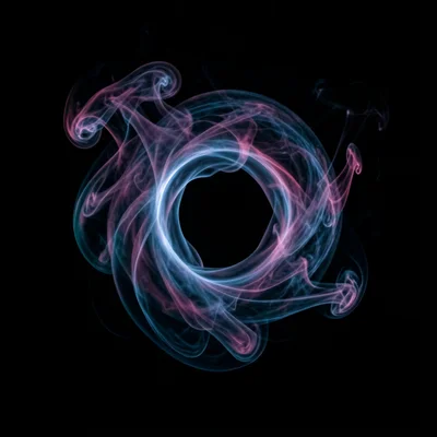 A vortex ring of smoke, the perfect donut shape lit from the side, its internal 