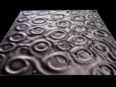 Liquid mercury pool showing subtle standing wave dimples