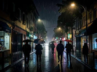 Rainy night street with umbrella silhouettes