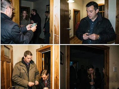 Someone retrieving forgotten phone, returning to dim party, most guests gone, th