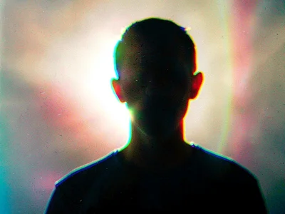 Backlit figure creating color blur