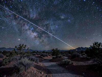 Satellite streak crossing natural trails