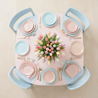 An Easter brunch table seen from directly above — symmetrical place settings in 