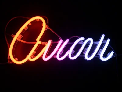Detail of hand-bent script lettering in neon: the graceful curves, the consisten